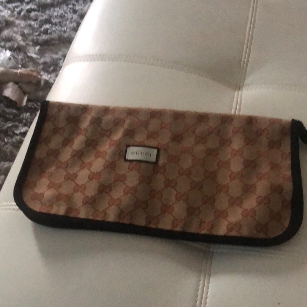 Authentic Gucci slipper pouch. Can be used as a clutch as well as a cosmetic bag